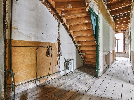 A stripped-back interior during termite repair work